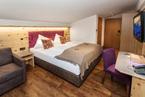 Rúm í herbergi á Hotel Talblick