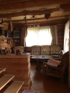 a living room with a couch and a table at Kazkova khatynka in Bushtyno