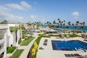 an aerial view of a resort with a pool and the ocean at Royalton Hideaway Punta Cana, An Autograph Collection All-Inclusive Resort & Casino - Adults Only in Punta Cana