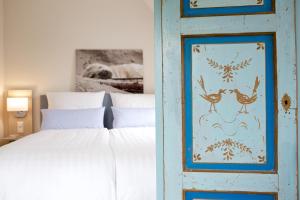 Postel nebo postele na pokoji v ubytování Hotel Jess am Meer