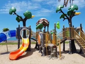 a park with a playground with a slide at DreamLand Apartments Oasis in Chakvi