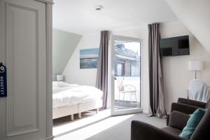 Postel nebo postele na pokoji v ubytování Hotel Jess am Meer