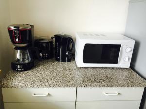 Kuchyň nebo kuchyňský kout v ubytování Mainzimmer Business Appartment - Monteurwohnung mit Burgblick + 7 fotografií