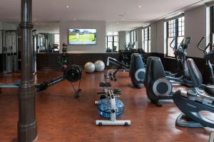 a gym with several treadmills and exercise bikes at The Goodwin in Hartford