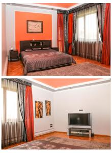 リヴィウにあるVilla ILonaのオレンジ色の壁のベッドルーム(ベッド1台、テレビ付)