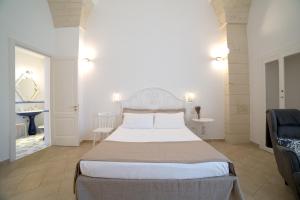 A bed or beds in a room at Nuvole Barocche