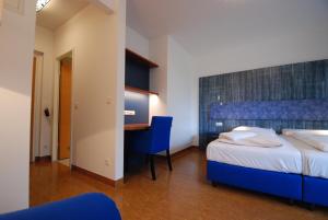 A bed or beds in a room at Kolping Campus Krems