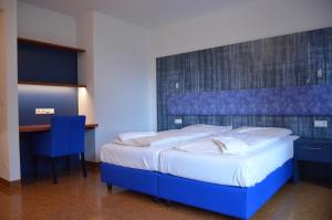 A bed or beds in a room at Kolping Campus Krems