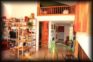 a living room filled with shelves and a television at La Luce della Luna in Castelnovo Bariano