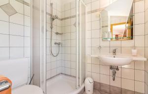 a bathroom with a shower and a sink and a toilet at Holiday House Barbara in Medulin +15 photos