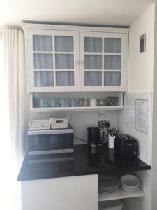 
A kitchen or kitchenette at The Retreat
