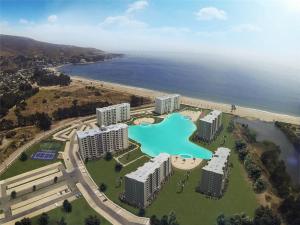 widok z lotu ptaka na ośrodek wypoczynkowy położony nad oceanem w obiekcie Apartamento Papudo Laguna 511B w mieście Papudo