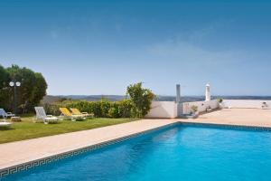 a swimming pool in front of a house at Alte Hotel in Alte