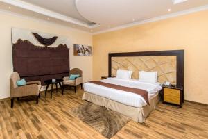 Rúm í herbergi á Flamingo Beach Hotel