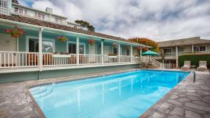 a swimming pool in front of a house at Carmel Bay View Inn in Carmel