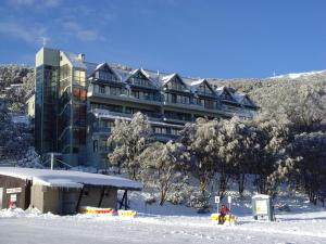 a large building with a ski lift on top of it at Falls Creek Country Club in Falls Creek