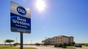 a sign for a best western inn and suites at Best Western Inn & Suites - Henrietta in Henrietta