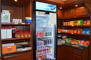
a refrigerator filled with lots of different types of food at Best Western Plus Wilkes Barre Center City in Wilkes-Barre
