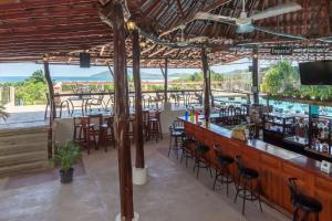 a bar with a view of the ocean at Best Western Tamarindo Vista Villas in Tamarindo
