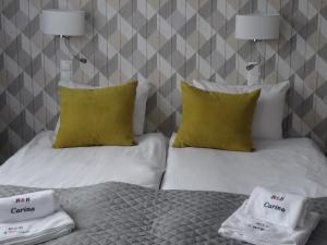 Postel nebo postele na pokoji v ubytování Carina Hotel
