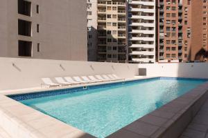 a swimming pool on the side of a building at Nueva Córdoba Duomo in Córdoba
