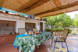 a table and chairs on a patio at B&B OTIUM in Pompei