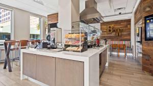 a kitchen with a counter with food on it at Best Western Oceanfront in Jacksonville Beach