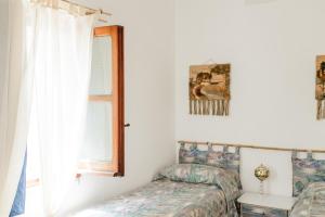 Postel nebo postele na pokoji v ubytování B&B OTIUM