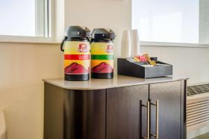 two water bottles sitting on top of a counter in a kitchen at Motel 6-Big Springs, NE in Big Springs