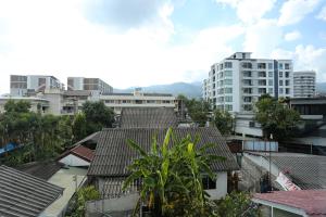 a view of a city with buildings and trees at Chomdoi House Hotel SHA Extra Plus in Chiang Mai