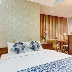 Tempat tidur dalam kamar di Sampit Residence Managed by FLAT06