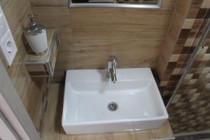 A bathroom at Verona Apartman Még 37 kép