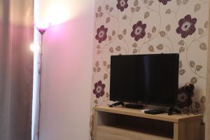 A television and/or entertainment centre at Verona Apartman