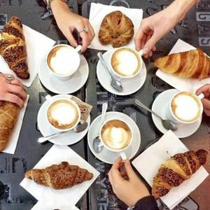 a group of people with cups of coffee and pastries at Casa Decò Business Stay Solution in Taranto