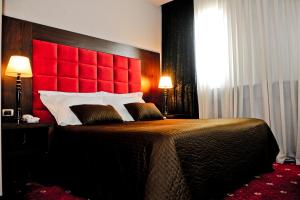 Postel nebo postele na pokoji v ubytování Hotel Doro City