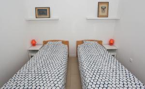 Postel nebo postele na pokoji v ubytování Apartman Kimi
