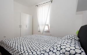 Postel nebo postele na pokoji v ubytování Apartman Kimi