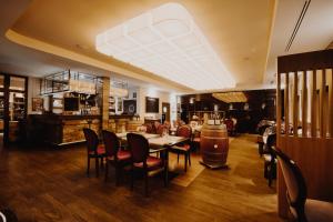 a dining room with a table and chairs at Hotel Figa in Plewiska