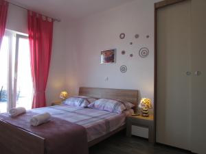 Postel nebo postele na pokoji v ubytování Villa Paladina