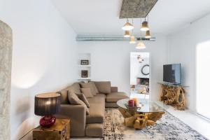 a living room with a couch and a table at VILLA CAN MASS Architect Country Villa in Sant Rafael de Sa Creu