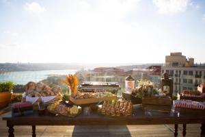 a table filled with lots of food on a balcony at Soho House Istanbul in Istanbul