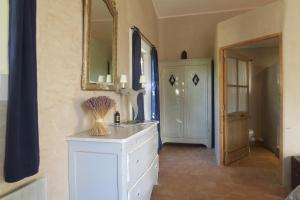 a bathroom with a white sink and a mirror at Le Clos d'Estellan - Piscine chauffée in Bonnieux +71 photos