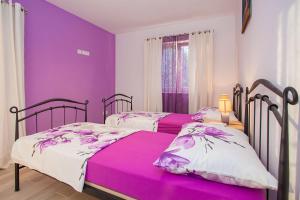 Postel nebo postele na pokoji v ubytování Villa Drinka Apartments