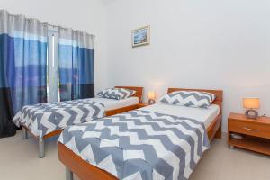 Postel nebo postele na pokoji v ubytování Villa Drinka Apartments