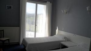 Postel nebo postele na pokoji v ubytování Auberge Béarn Bigorre
