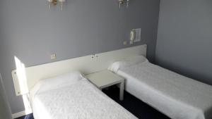 Postel nebo postele na pokoji v ubytování Auberge Béarn Bigorre
