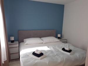 Postel nebo postele na pokoji v ubytování Villa Drinka Apartments