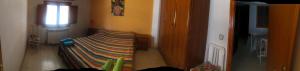 A bed or beds in a room at Casa Rural González Montsec Montrebei