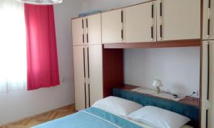 מיטה או מיטות בחדר ב-Apartments Zrilić