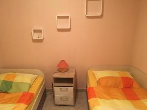 Postel nebo postele na pokoji v ubytování Apartman Petra 1